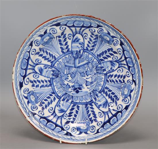 An 18th century English Delft blue and white charger with foliate decoration diameter 30cm
